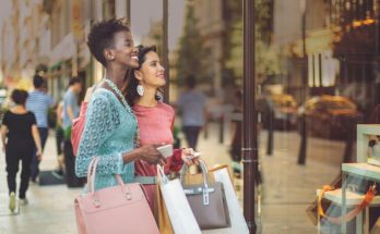two women holding shopping bags