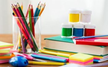 pencils- books on a wooden table