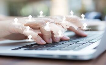 Closeup of business woman hand typing on laptop keyboard