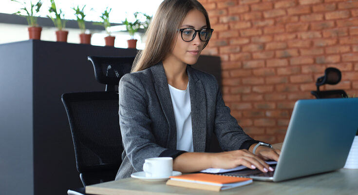 Beautiful Business Woman Working On Laptop In The Office