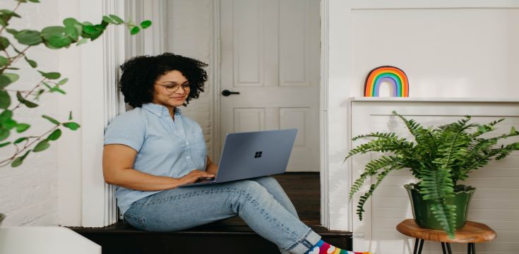 female-using-notebook-smiling