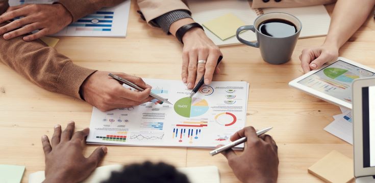 people-discuss-business-graphs