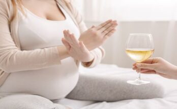 pregnant-woman-with-crossed-hands-refusing-to-drink