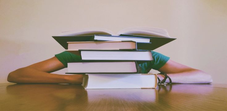 Person-behind-books-student