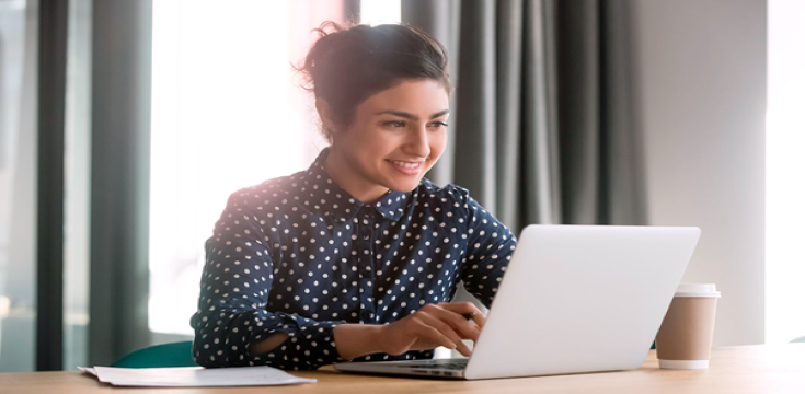 Female-using-laptop-desk