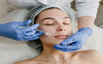 portrait-young-woman-during-cosmetology-procedures-beauty-salon-injecting-botox-hands-blue-glows-healthcare-therapy-lips-beauty