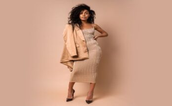 sensual-black-woman-with-beautiful-wavy-hairs-golden-shiny-dress-posing-full-length