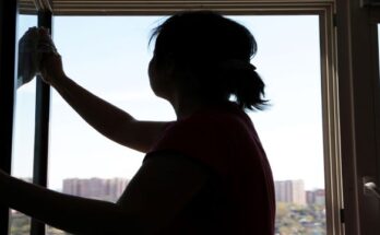 Silhouette of woman cleaning