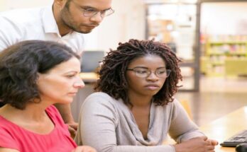 adult-female-students-consulting-instructor