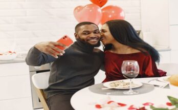 couple-sitting-table-having-meal-talking-laughing-valentine-s-day