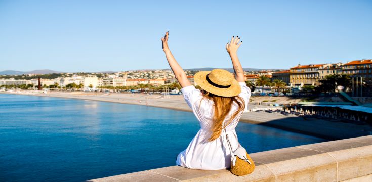 happy-elegant-woman-posing-back-put-her-hand-air-enjoying-amazing-view