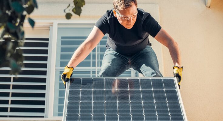 person-installing-solar-home