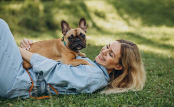 young-woman-with-her-pet-french-bulldog-park