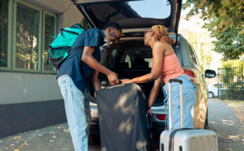 african-american-couple-loading-baggage-vehicle-leave-holiday-vacation-trip-partners-travelling-by-car-with-luggage-suitcase-bags-go-summer-adventure-cityscape