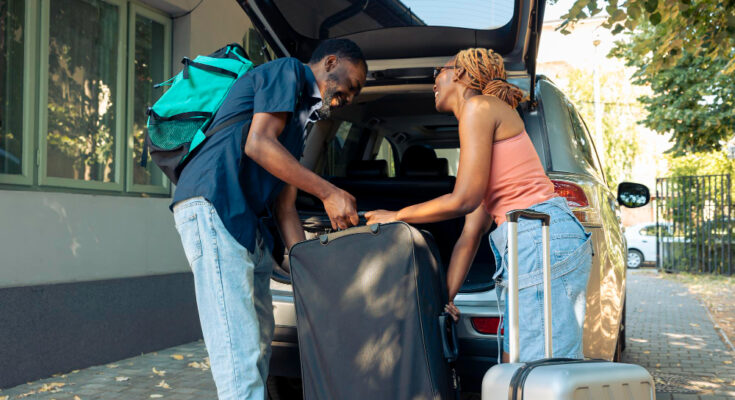 african-american-couple-loading-baggage-vehicle-leave-holiday-vacation-trip-partners-travelling-by-car-with-luggage-suitcase-bags-go-summer-adventure-cityscape