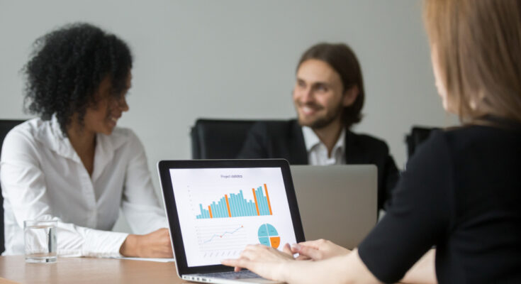 businesswoman-working-with-project-statistics-preparing-report-team-meeting