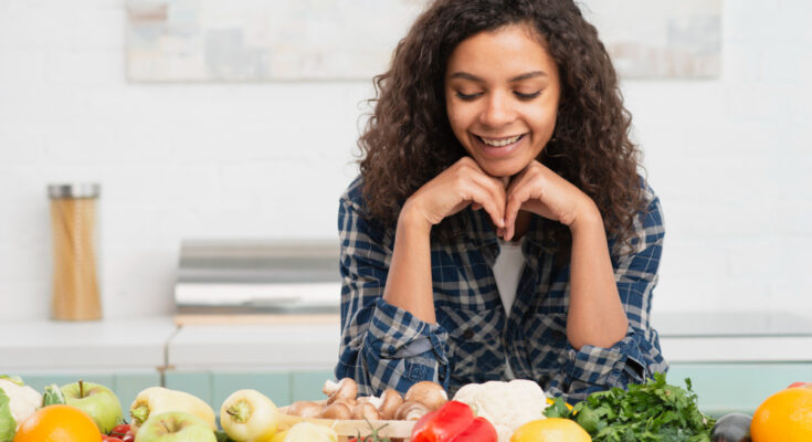portrait-smiling-woman-looking-vegetables
