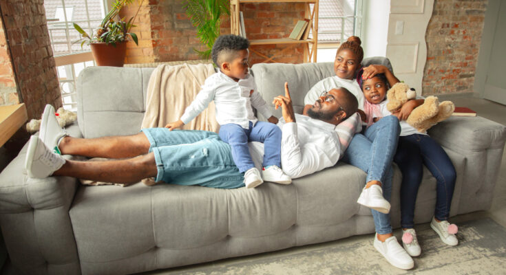 young-cheerful-african-family-spending-time-together-home