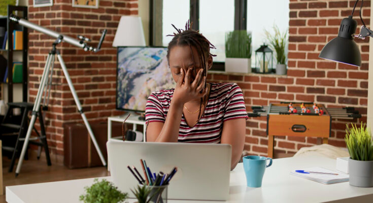 stressed-businesswoman-with-headache-working-remotely-laptop-home-feeling-tired-frustrated-about-work-deadline-doing-remote-job-suffering-from-painful-migraine-tension